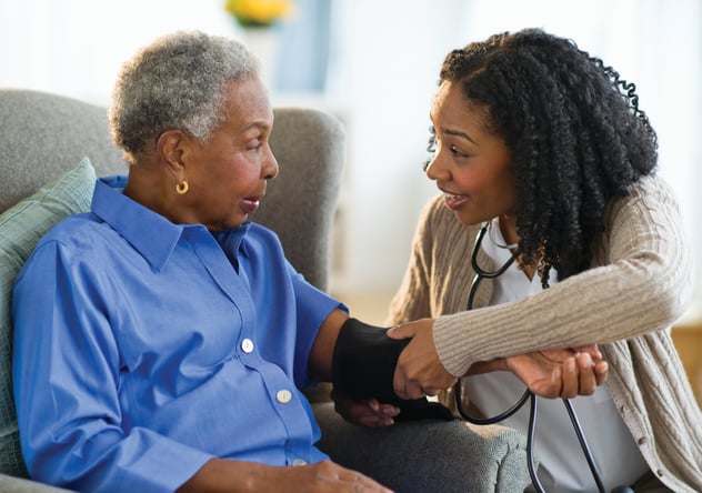 nurse taking patient's blood pressure
