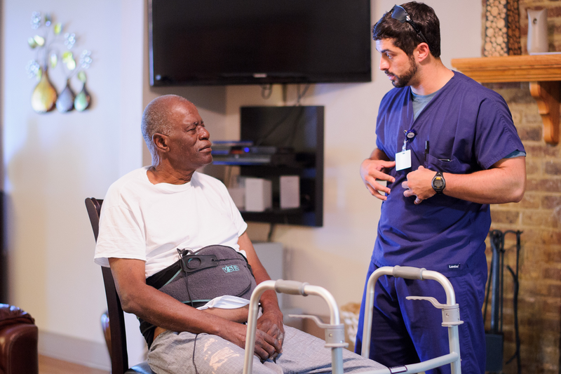 patient at home with physical therapist talking about fall prevention