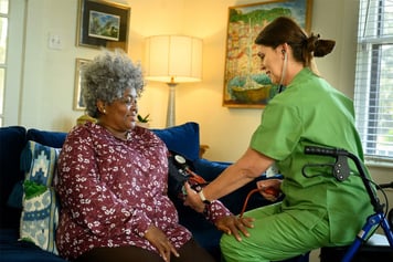 Hospice nurse assists a pulmonary patient.