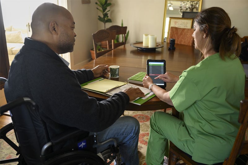 A hospice nurse discussing hospice care, palliative care and comfort care options with a patient