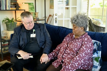 A bereavement counselor helping a hospice patient.
