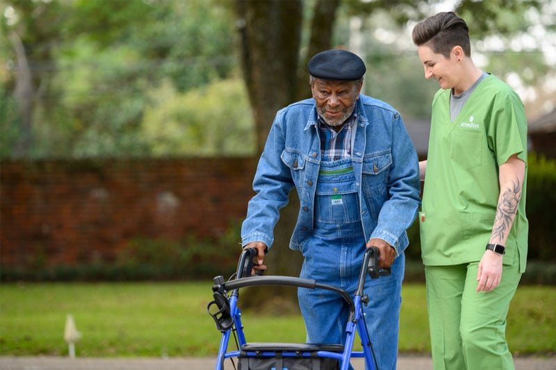 Home health nurse helping COPD patient.