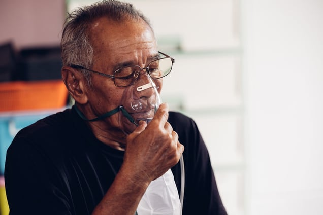 Man using oxygen mask