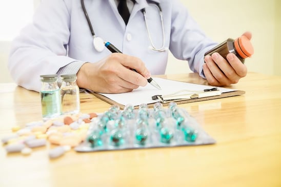 Physician reviewing medications