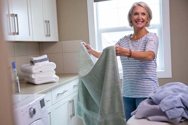 Woman folding laundry