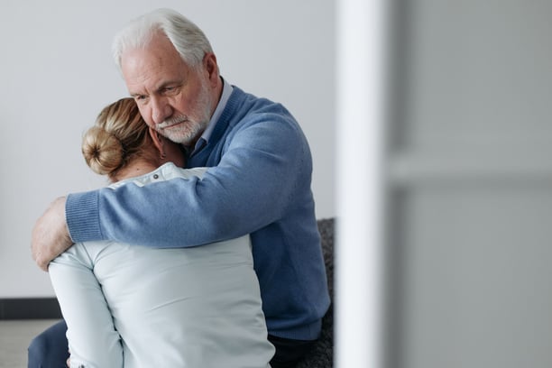 Man comforting woman