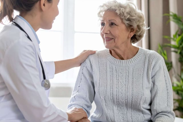 clinician talking to elderly patient