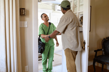 A physical therapist arriving at a patient's home