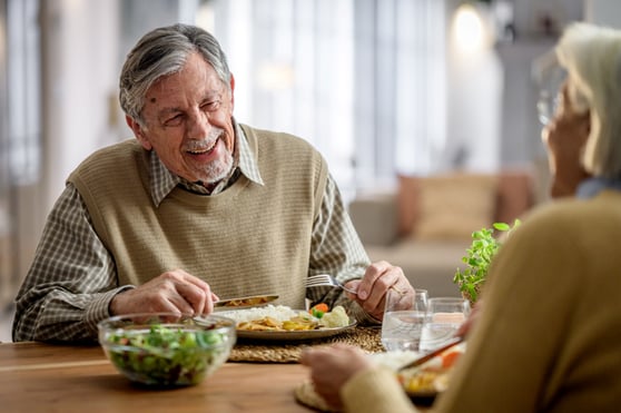 elderly man eating dinner