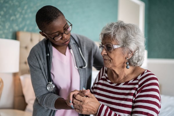 doctor examining elderly patient