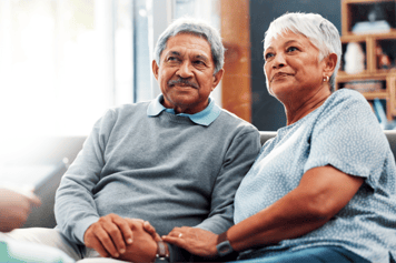 older couple holding hands 
