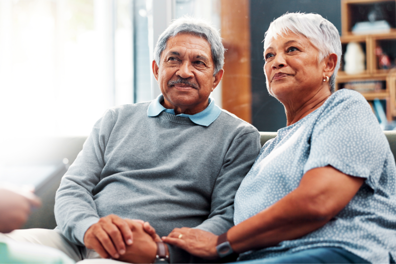 older couple holding hands 